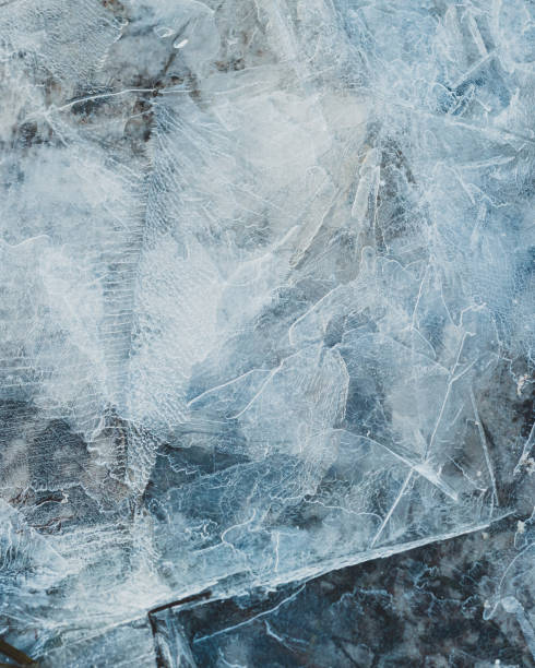 cracked ice close up, deep frozen lake blue ice texture, repeating pattern - ice hockey ice ice skating sport imagens e fotografias de stock