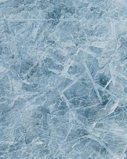 istock cracked ice close up, deep frozen lake blue ice texture, repeating pattern 1392903714