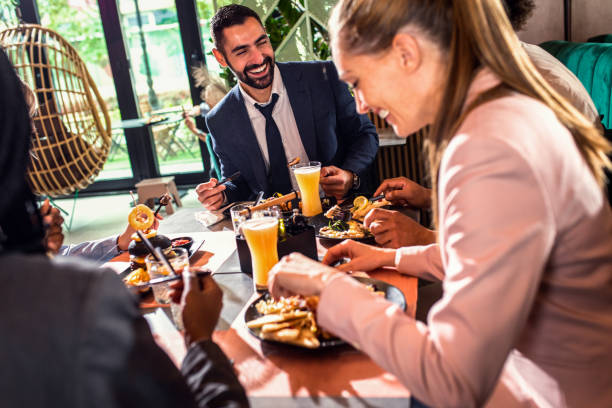 istock Businesswoman having lunch in restaurant. 1392904837
