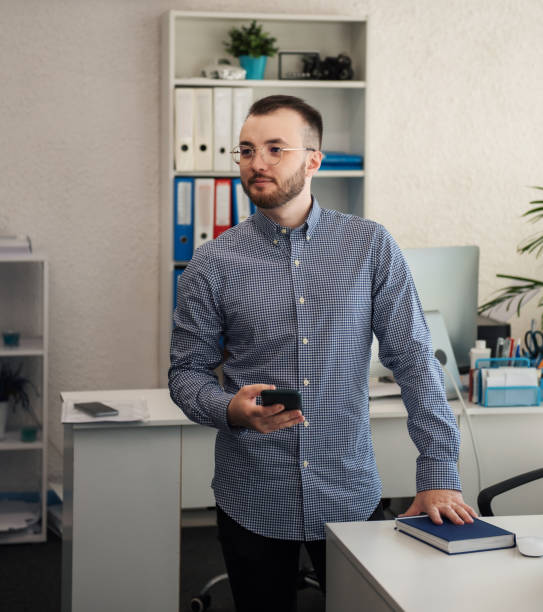 istock Businessman working on his laptop in an office 1392905431