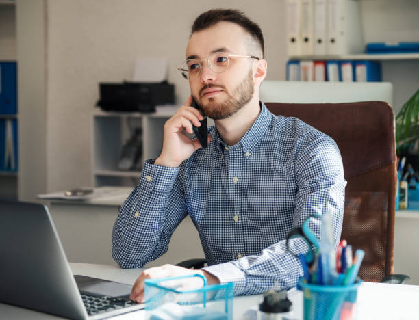 istock Businessman working on his laptop in an office 1392905458