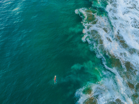 Scenic aerial view of surfing in  Puerto Escondido  beach at sunset