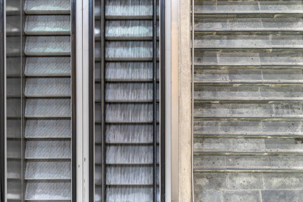istock geometric pattern of escalators and cement staircase. 1392907064