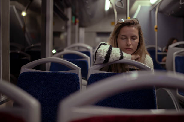 istock The businesswoman returns home after the third shift by bus. 1392911368
