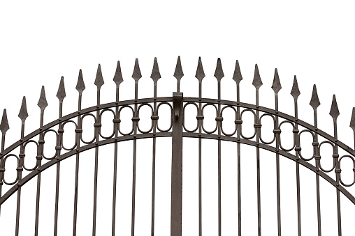 Close-up of a wrought iron gate with sharp points (arrows or spears), isolated on white background with copy space.