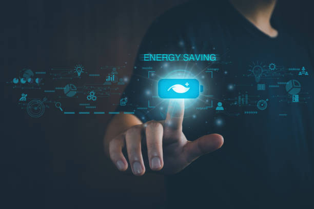 istock Energy saving concept. Person touching the battery saver button. On the virtual screen, help save energy, reduce global warming, save the environment, reduce pollution, eco-technology. 1392913255