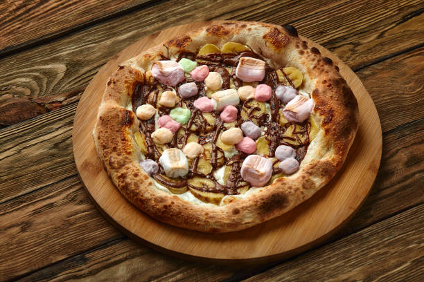 istock Whole sweet pizza served with marshmallows and candies 1392914336