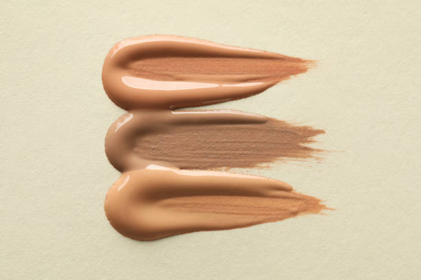 istock Samples of liquid skin foundations on beige background, top view 1392915203