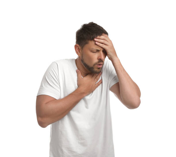istock Man suffering from pain during breathing on white background 1392917066