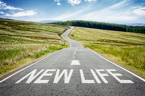 New life sign on the highway disappearing into the distance concept for fresh start, new job or career, new year resolution, dieting or healthy lifestyle