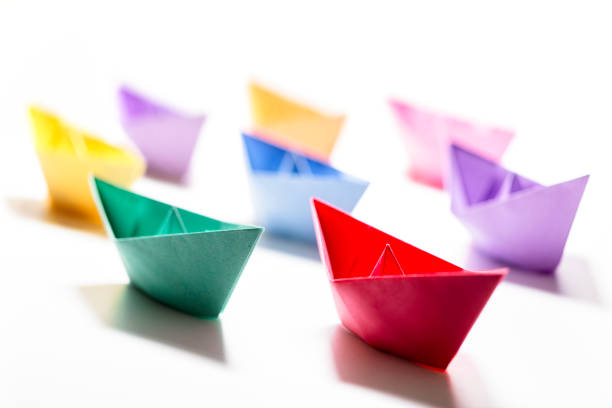istock Paper boats leadership, teamwork and winning success 1392917755