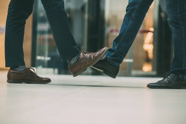 istock close up. young people greeting each other 1392917775