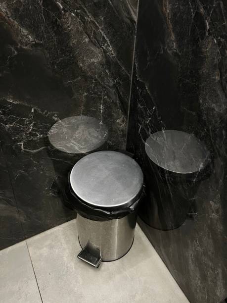 istock trash can and black tiles 1392922715