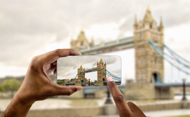 istock tourist photographing london bridge 1392922901