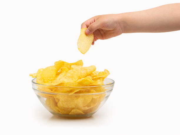 istock child catching a potato chip 1392923508