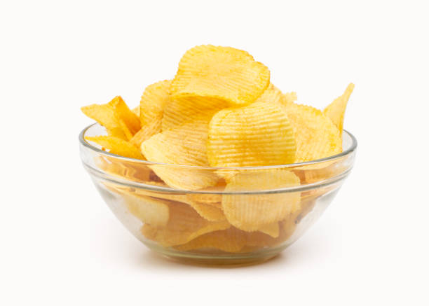 wavy potato chips in a glass bowl