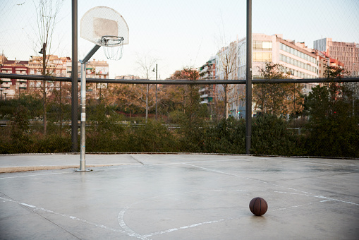 Streetball basketball in a court under the hoop.