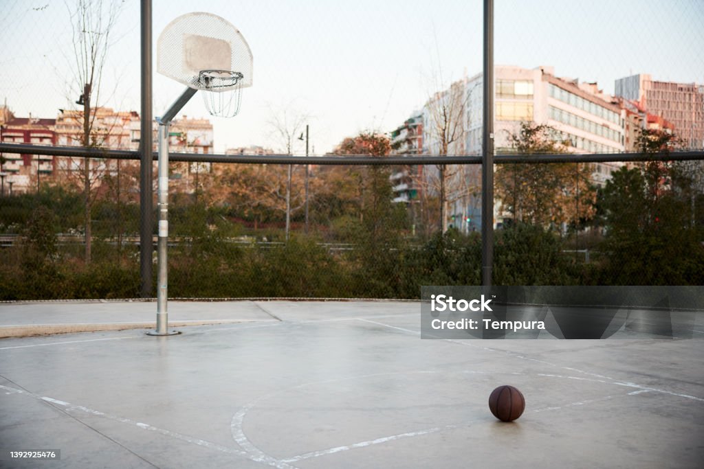 Streetball basketball in a court under the hoop. Basketball - Ball Stock Photo