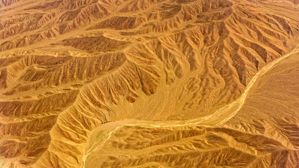 istock Desert mountains with dry riverbed 1392927070