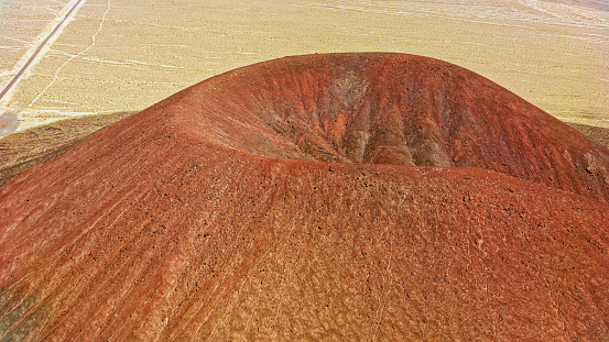 Aerial view of volcanic cinder cone at red hill in Silver Peak, Nevada, California, USA.