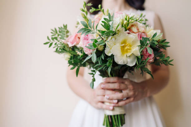 Free Stock Photo of Woman in Wedding Dress Holding Bouquet of Flowers ...