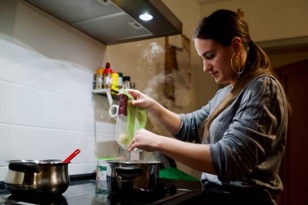 istock Young woman prepares a fresh pasta 1392929995