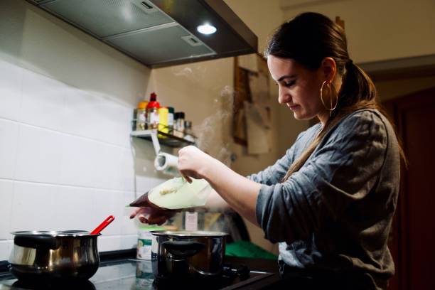 istock Young woman prepares a fresh pasta 1392929997