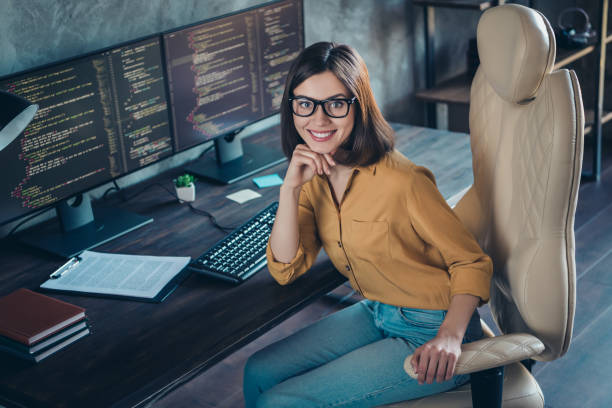 istock Portrait of attractive cheerful skilled girl agent broker director debugging web project at workplace workstation indoors 1392930242