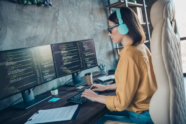 istock Profile portrait of serious smart web designer sitting chair keyboard write edit database workplace inside 1392932935
