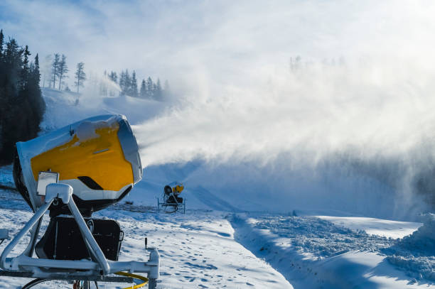 istock Snow cannon in winter mountains. Snow-gun spraying artificial ice crystals. Machine making snow. 1392933264