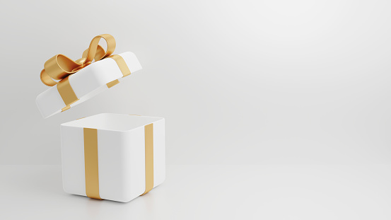 Gift box with blue ribbon on white. This file is cleaned, retouched and contains clipping path.