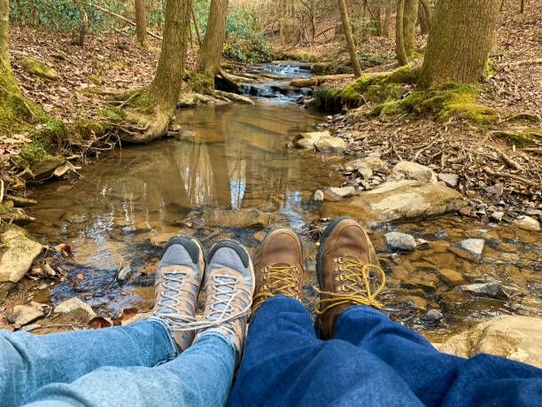 istock Couple taking a break from hiking. 1392937080