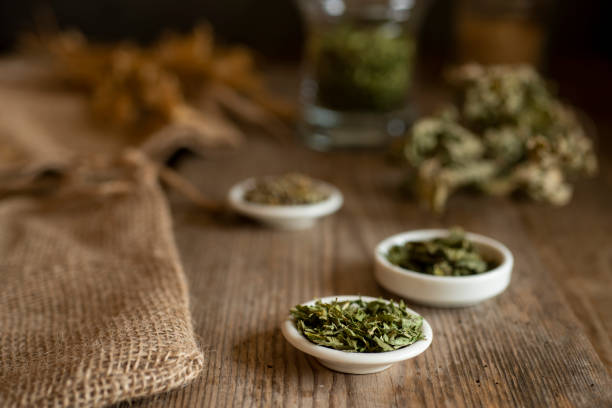 Different kinds of tea or herbs on an old table