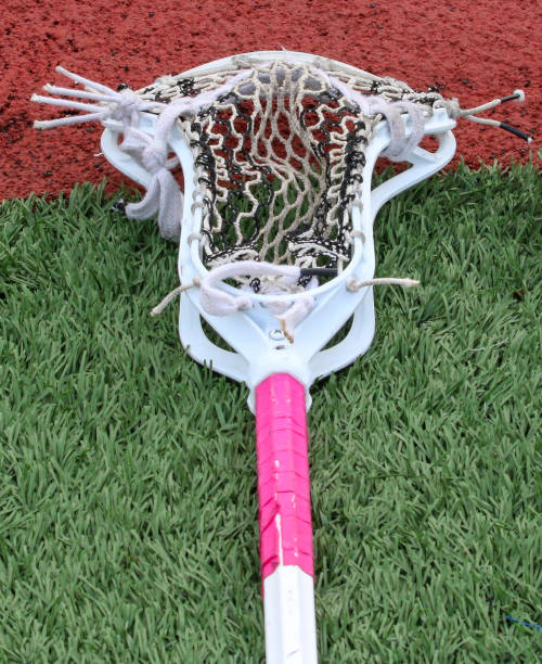 istock One lacrosse stick with pink tape and white netting 1392937367