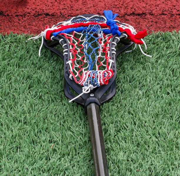 istock One lacrosse stick with red white and blue netting 1392937903