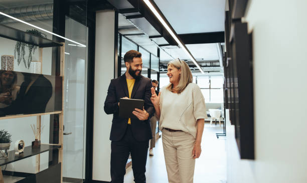 istock Diverse businesspeople laughing during a discussion 1392938623