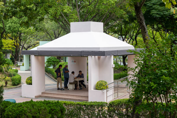 Hong Kong - April 22, 2022 : People playing chess at a park in Kowloon City, Hong Kong.