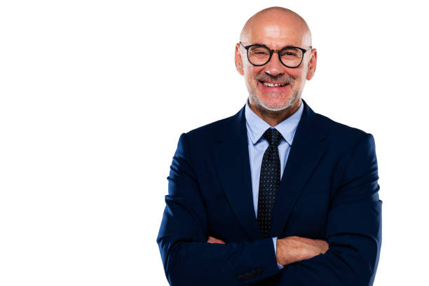 istock Middle aged businessman wearing suit and tie while standing at isolated background 1392943704