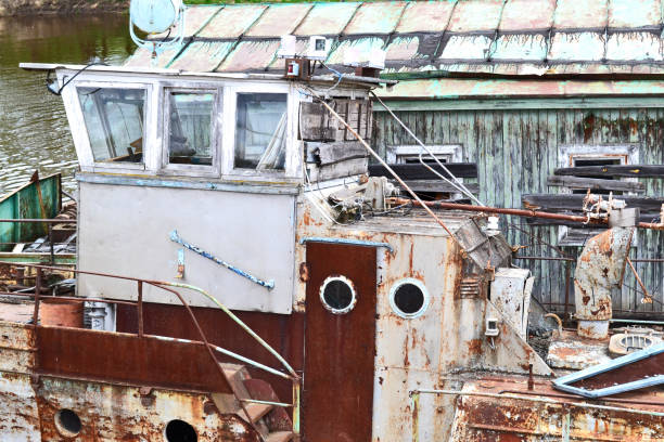 istock The old abandoned river port on the river cargo rusty ships. An old sand barge. 1392944031