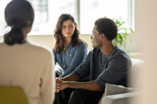 Man Sharing During Couples Counseling stock photo