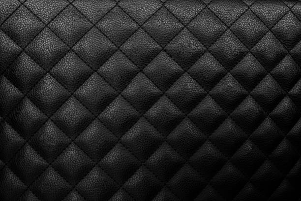 istock Sofa texture dark tone color, luxury design, skin background 1392945717
