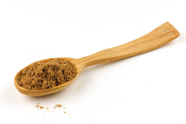 istock Ground coriander seasoning in a wooden spoon isolate 1392954973