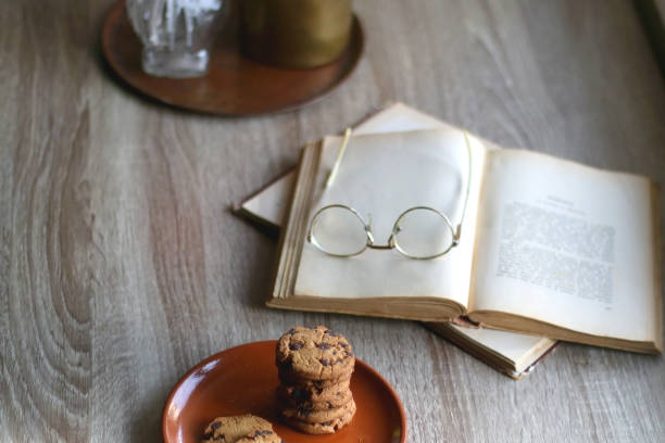 istock Stack of Cookies, Book, Glasses and Home Decor 1392965445