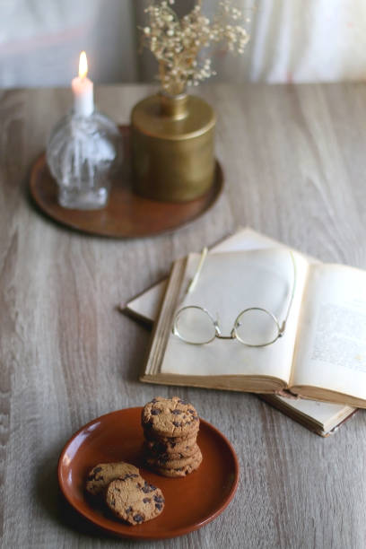 istock Stack of Cookies, Book, Glasses and Home Decor 1392965449