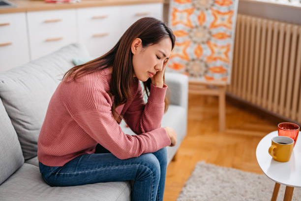 istock Young Woman Having A Headache 1392969060
