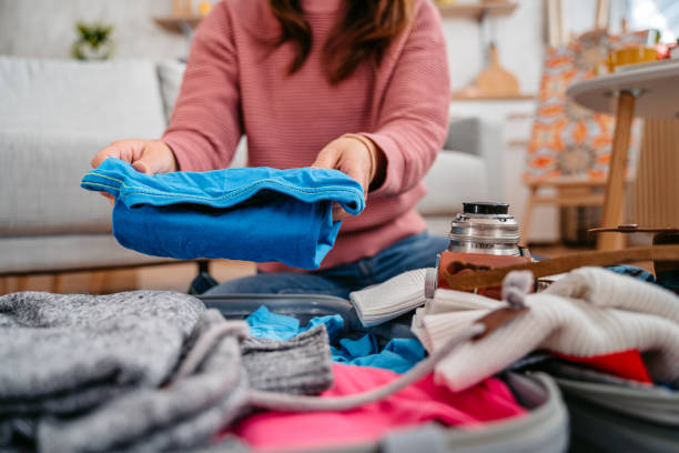 istock Young Woman Packing For A Trip 1392969716