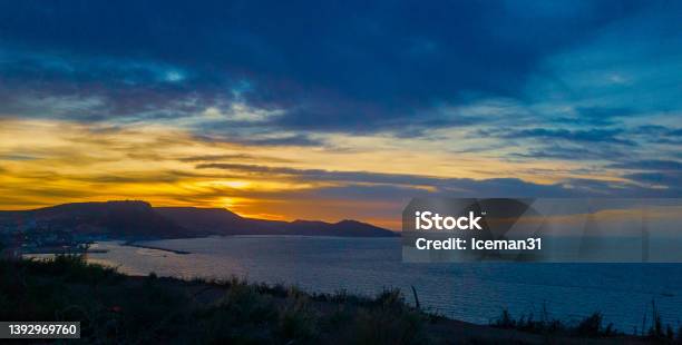 Sunset Above The Sea Dramatic Sky And Sunset Above The Coast Of Oran With Moutains In The Background Stock Photo - Download Image Now