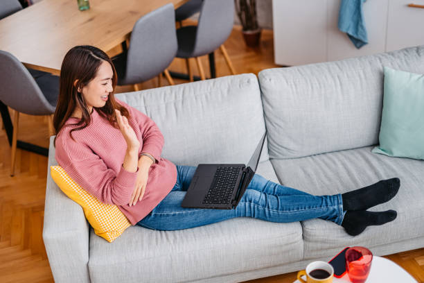 istock Young Woman Having A Doctor's Appointment Online 1392970240