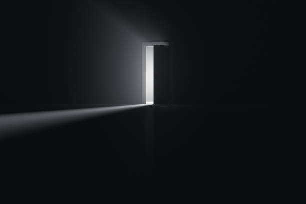 istock Ajar door to a room with bright light 1392975120