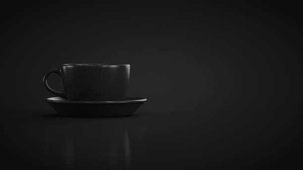 istock Black mug with a saucer on a black background. Copy space 1392975130